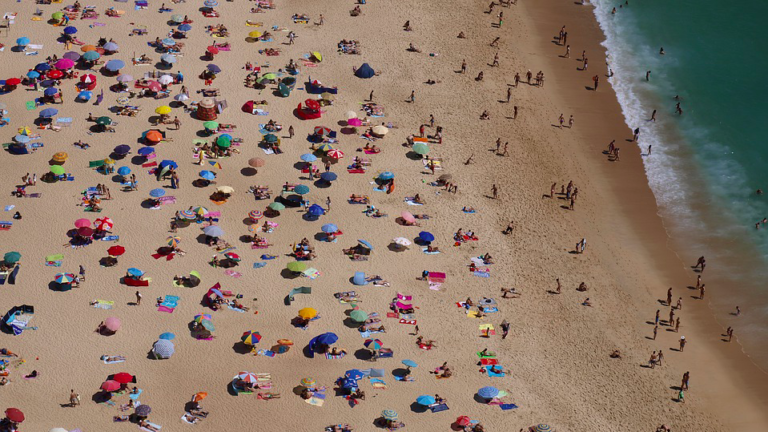 Overcrowding in parks and at the beach on summery Ascension Day