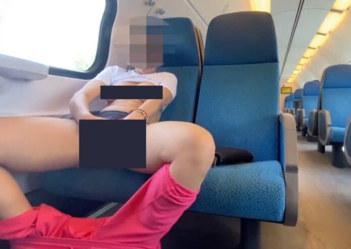 Woman-touching-herself-on-front-of-train