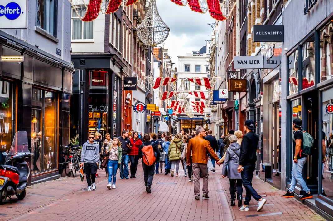 Kalverstraat-a-popular-shopping-streeting-in-amsterdam-the-netherlands-filled-with-lots-of-people