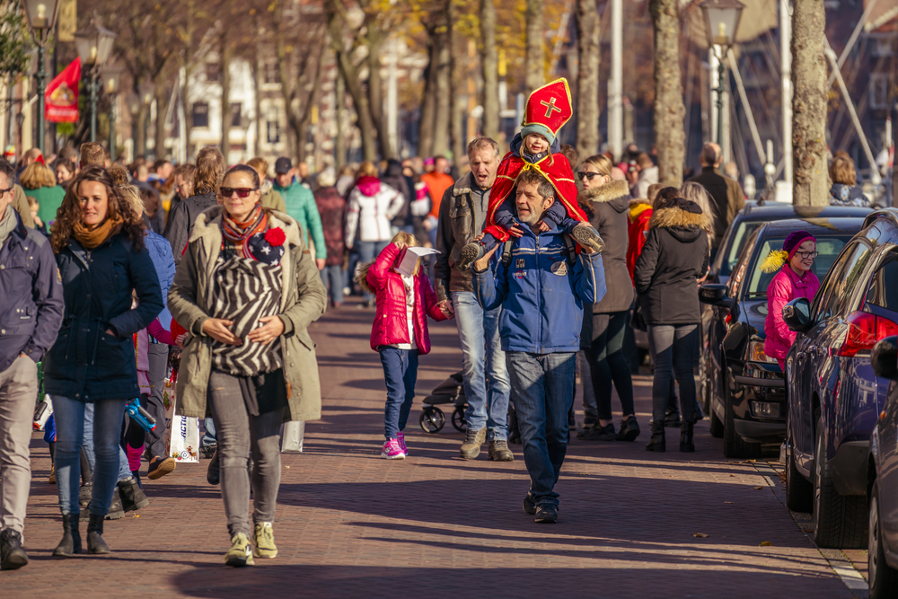 photo-of-parents-and-children-walking-to-see-sinterklaas-arrival-in-netherlands