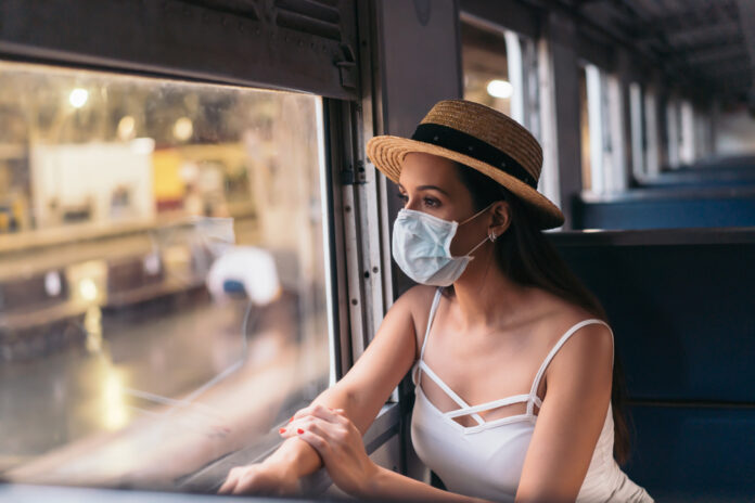Photo-of-woman-on-train-wearing-face-mask
