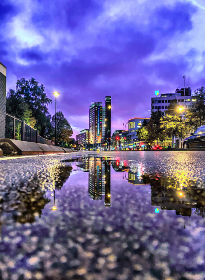 Mystic city hall of Tilburg at night with reflection in the water on  Netherlands. Historic dutch architecture in down town. Tourist attraction  Stock Photo - Alamy