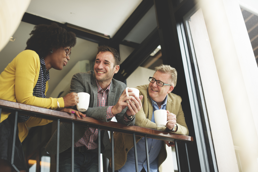 photo-group-of-Dutch-colleagues-taking-a-coffee-break-and-talking 