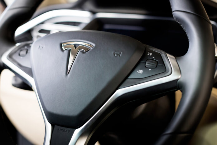 Tesla-logo-on-the-steering-wheel-inside-the-car