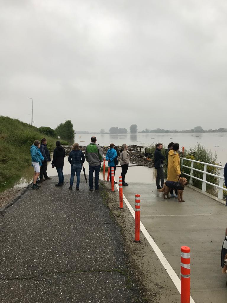 Flooding-in-Limburg-crowds-gather-in-Elsloo-village-to-look-at-what-was-a-field