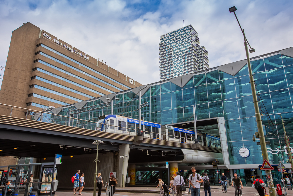 Tram-exiting-train-station-on-platform