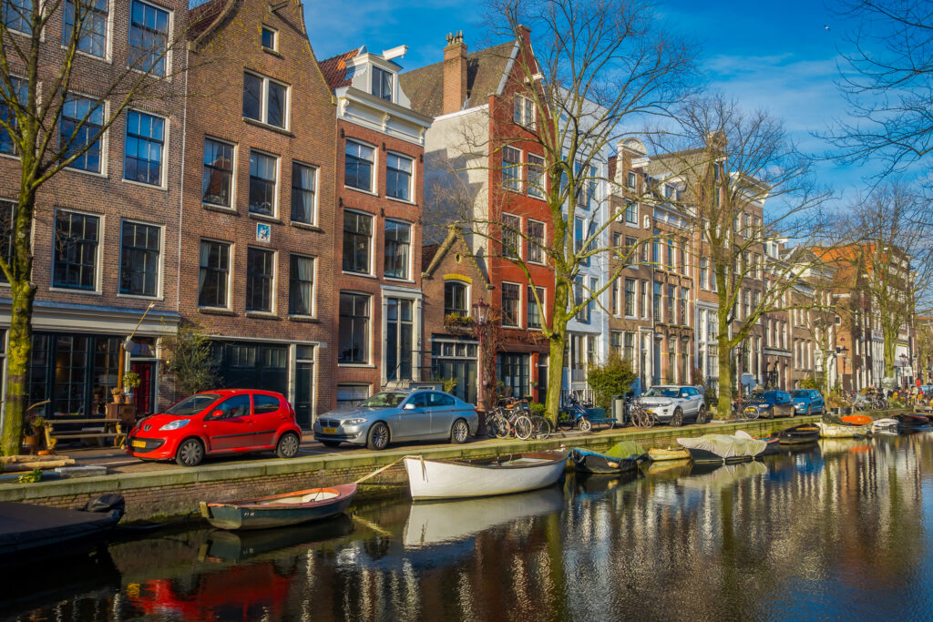 photo-of-cars-parked-along-canal-netherlands