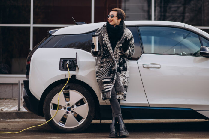 photo-of-woman-charging-car-using-electricity-Netherlands