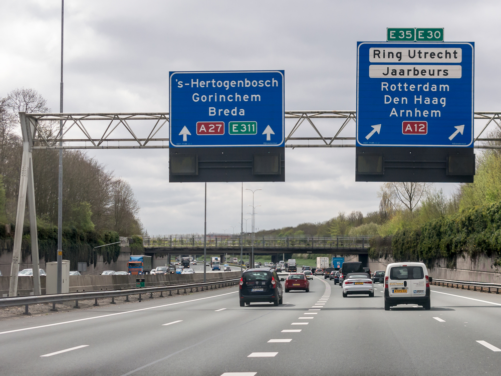 Cars-on-highway-wth-signs-in-Netherlands-to-A12