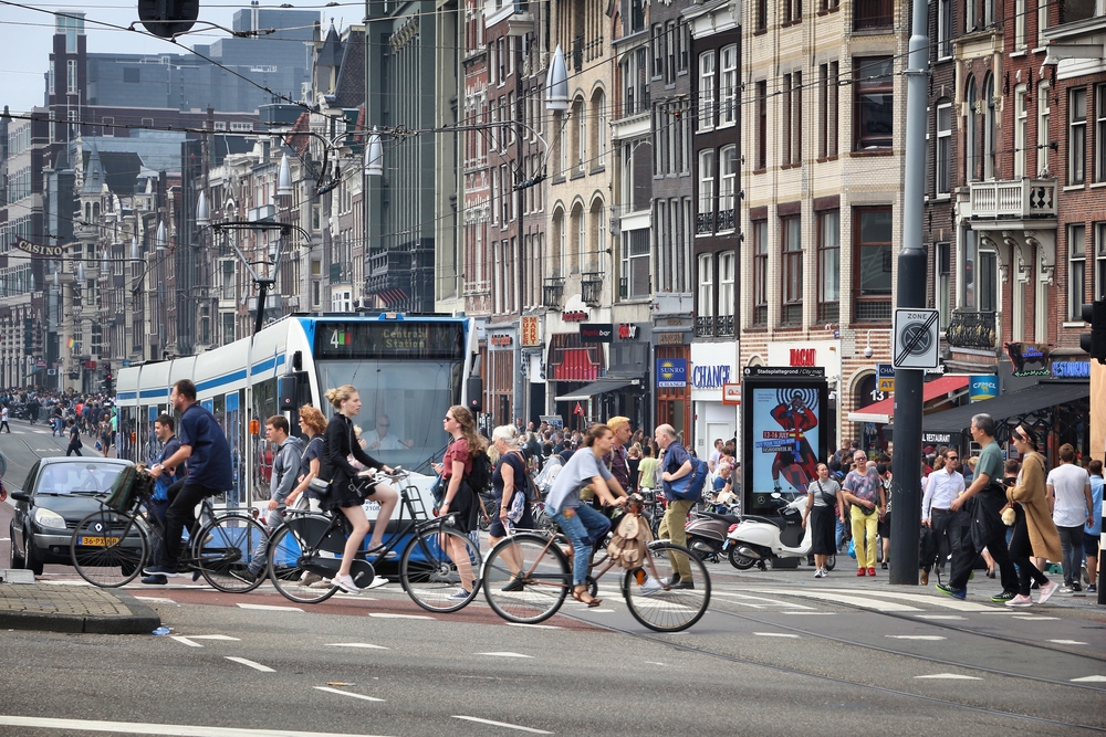people-cycling-in-front-of-amsterdam-tram