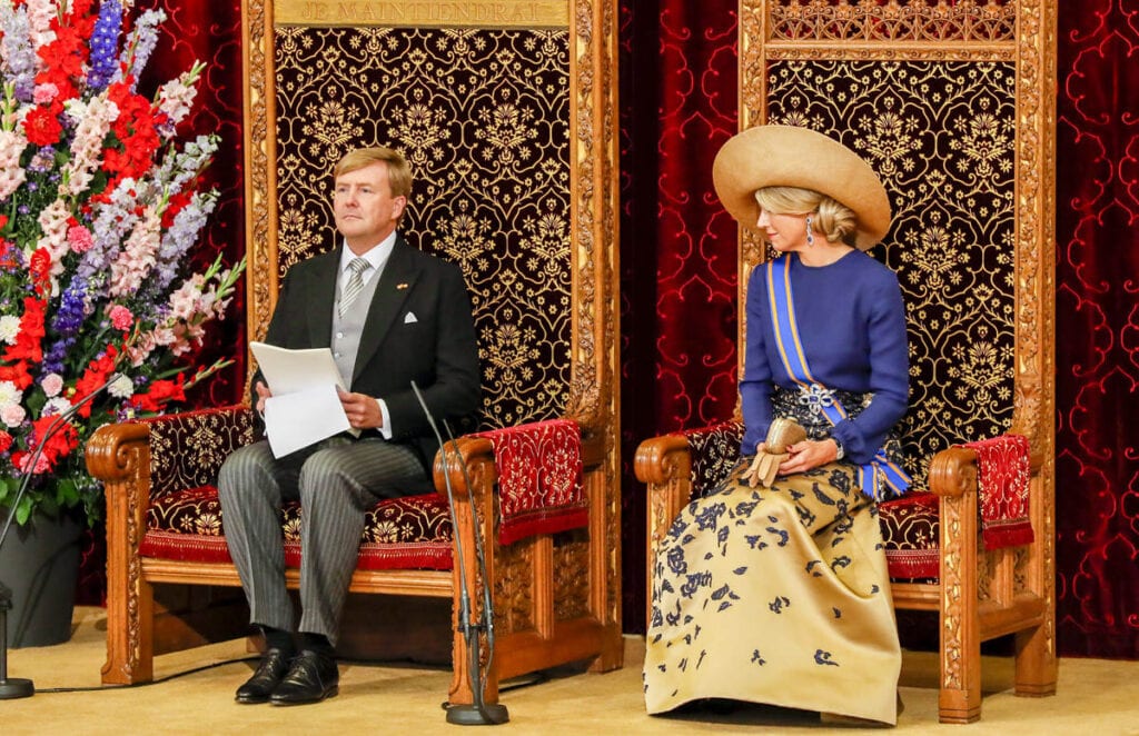 Photo-of-Queen-Maxima-of-the-Netherlands-sitting-on-throne-next-to-Dutch-King-Willem-Alexander