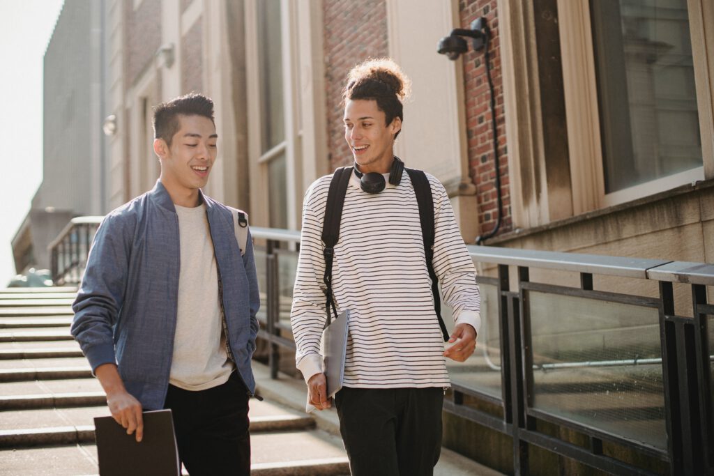Two-male-students-walking-together-after-university-class-in-the-Netherlands-getting-to-know-each-other