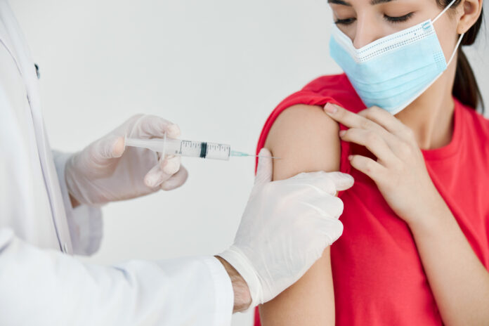 Woman-getting-vaccinated-by-doctor