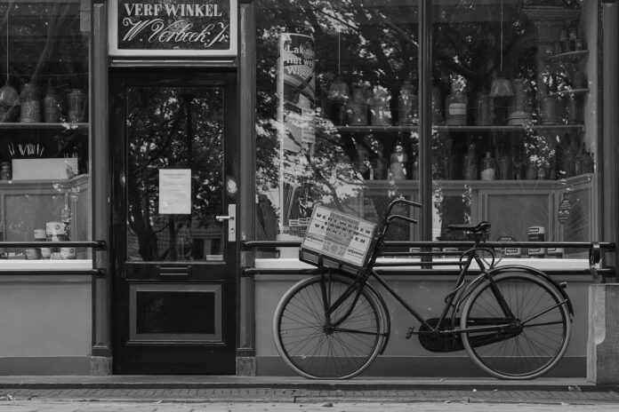 Bike-on-street-in-front-of-store-next-to-door