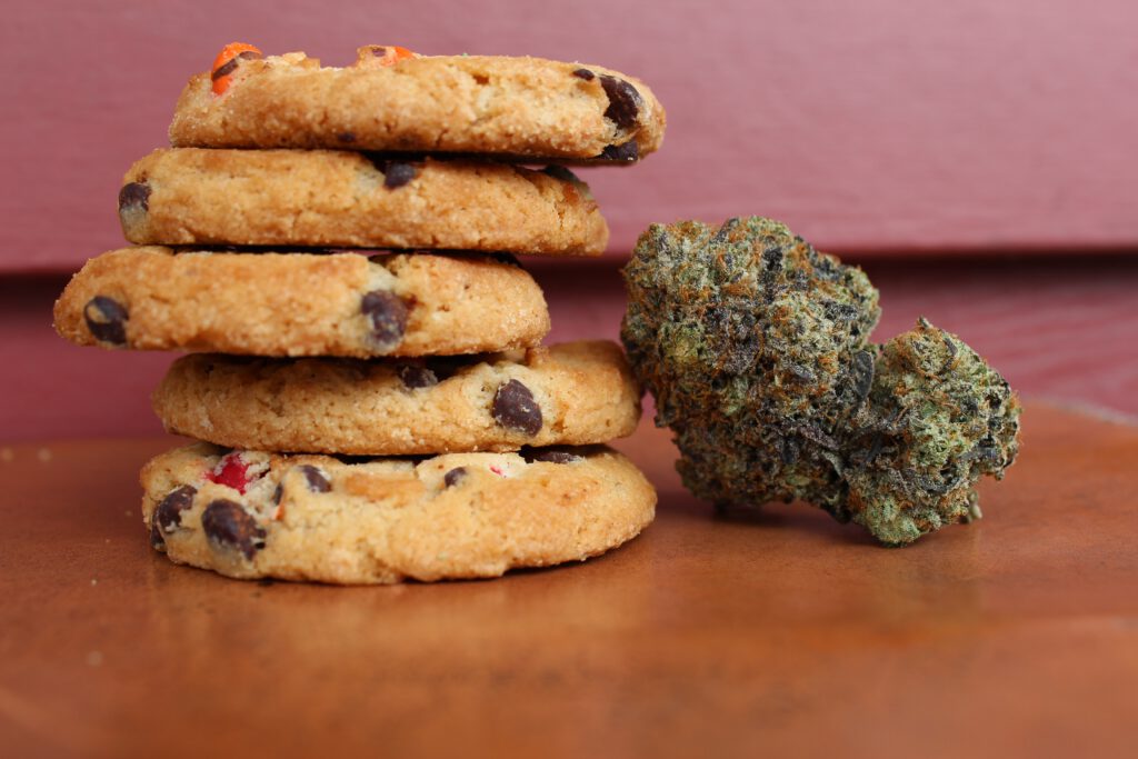 photo-of-stack-of-chocolate-chip-cookies-with-a-weed-bud-next-to-it