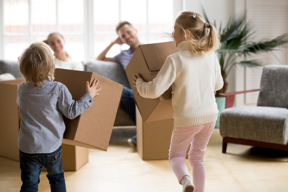 Photo-of-family-unpacking-boxes-in-new-house-with-children-after-buying-house-with-Dutch-NHG