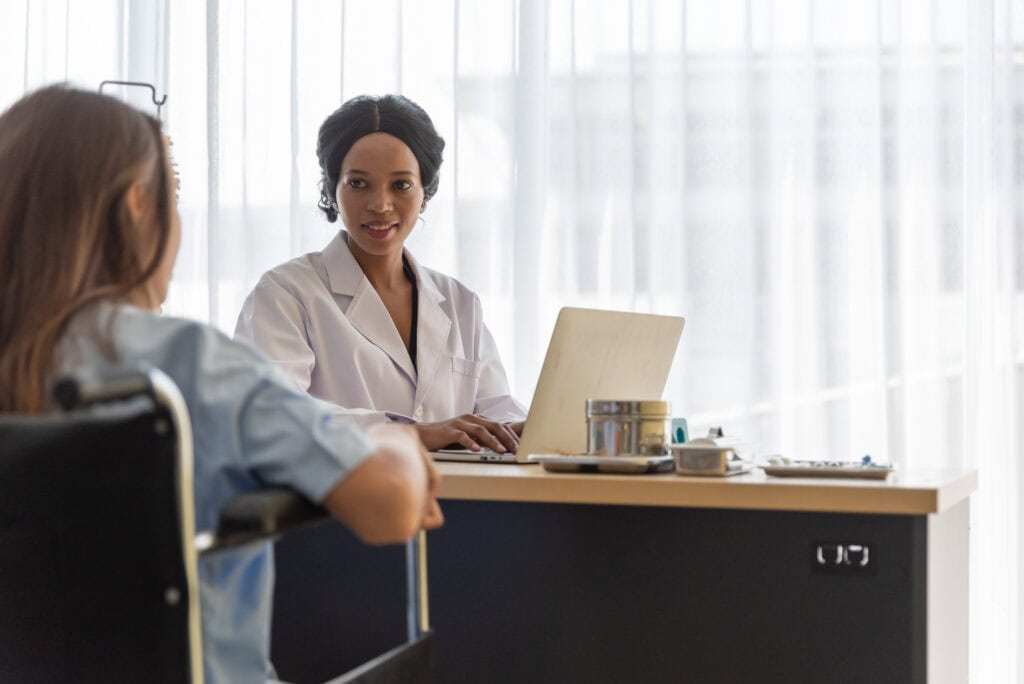 photo-of-doctor-discussing-health-issues-with-patient-who-has-taken-out-health-insurance-in-the-Netherlands-one-of-many-different-types-of-insurances-in-Netherlands