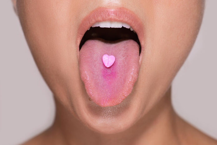 photo-of-pill-on-tongue-MDMA-netherlands