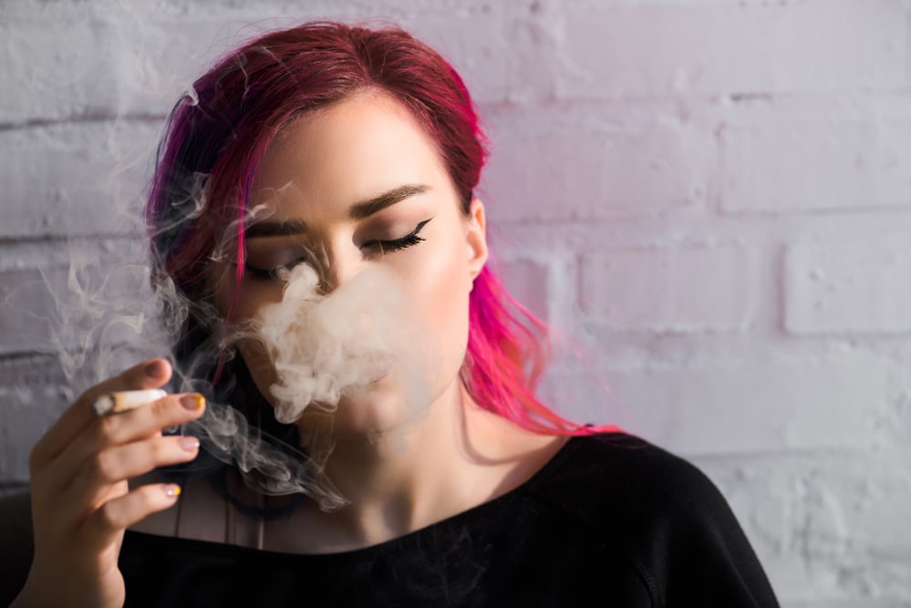 woman-with-pink-hair-smoking-a-joint