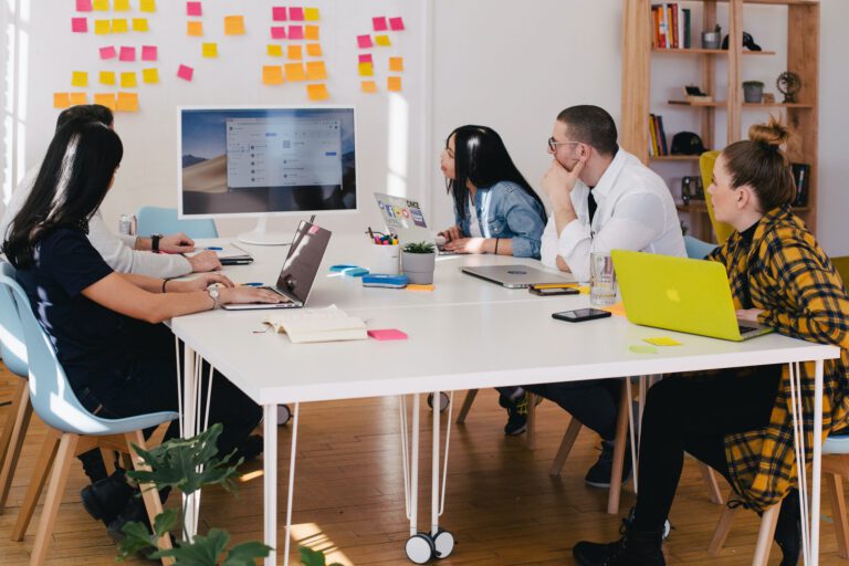 Young-people-sitting-around-a-table-at-work