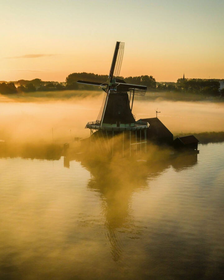Windmills at the Zaanse Schans on a foggy morning