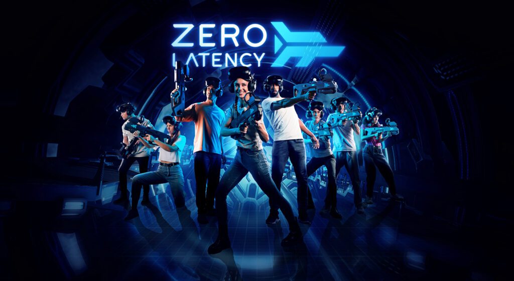 People-posed-in-front-of-black-backdrop-with-vr-gear-and-zero-latency-vr-logo