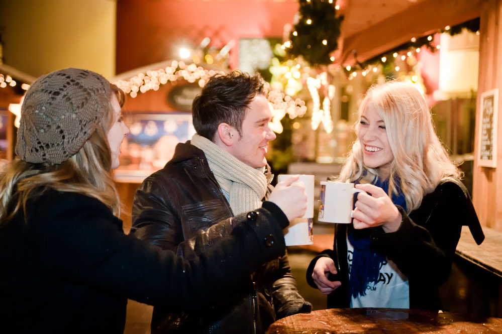 a-group-of-friends-drinking-hot-chocolate-at-a-christmas-market-in-the-netherlands
