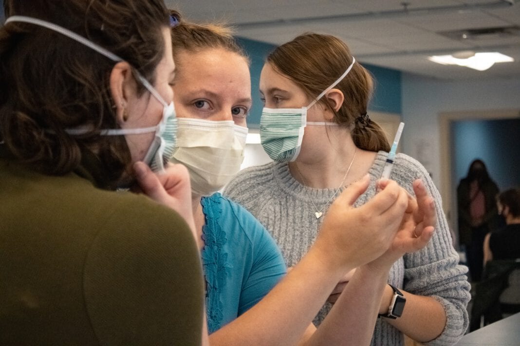photo-of-three-women-with-coronavirus-vaccine