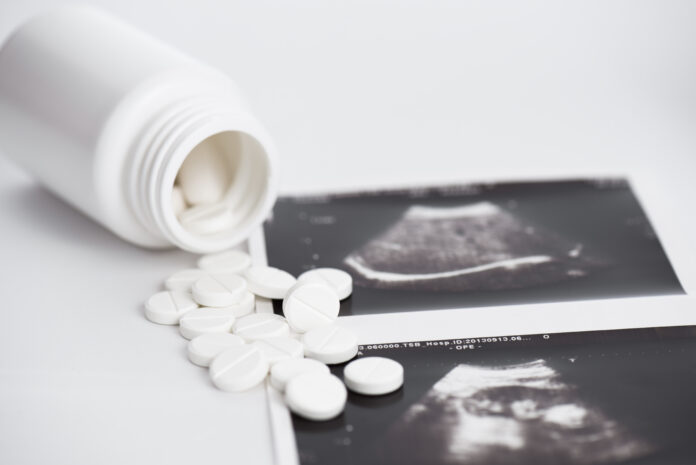 pill-bottle-for-abortion-with-picture-of-ultrasound-baby