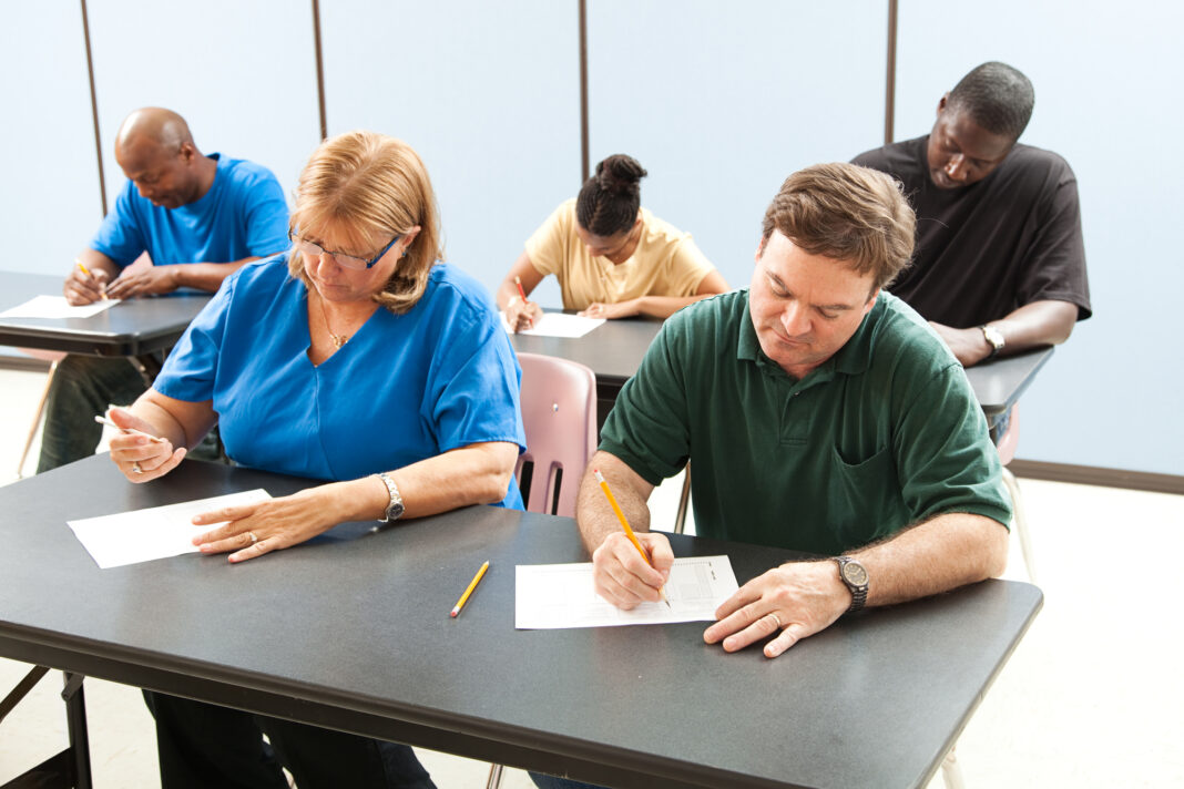 adults-taking-test-in-classroom