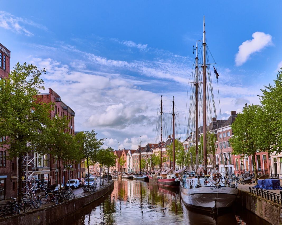 A Guide To The Best Student Cities In The Netherlands In 2024   Alexei Maridashvili Groningen Canal With Boats Unsplash 1 1068x854 