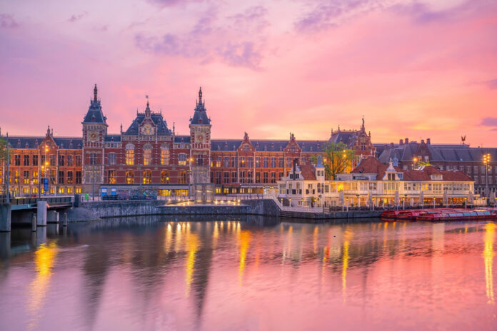 photo-of-amsterdam-centraal-station-at-sunset