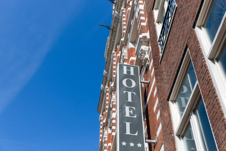 photo-of-hotel-sign-amsterdam-classical-dutch-facade