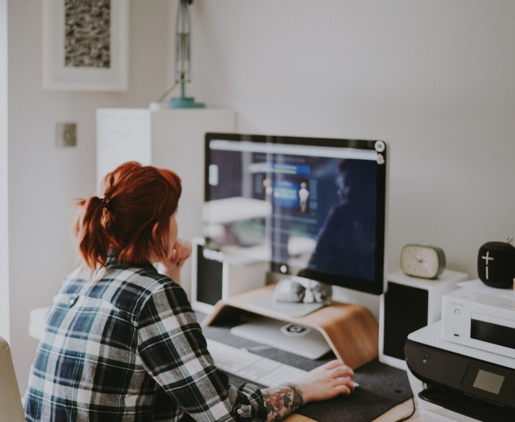 Photo-of-woman-sitting-at-desk-working-from-home-rethinking-Dutch-mortgage-and-renovation