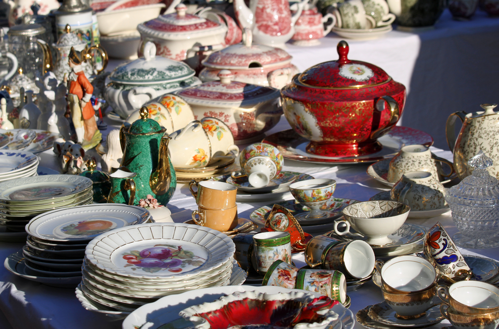 photo-of-precious-antique-furnishings-and-retro-ceramic-plates-for-sale-vintage-shop-market-in-Amsterdam