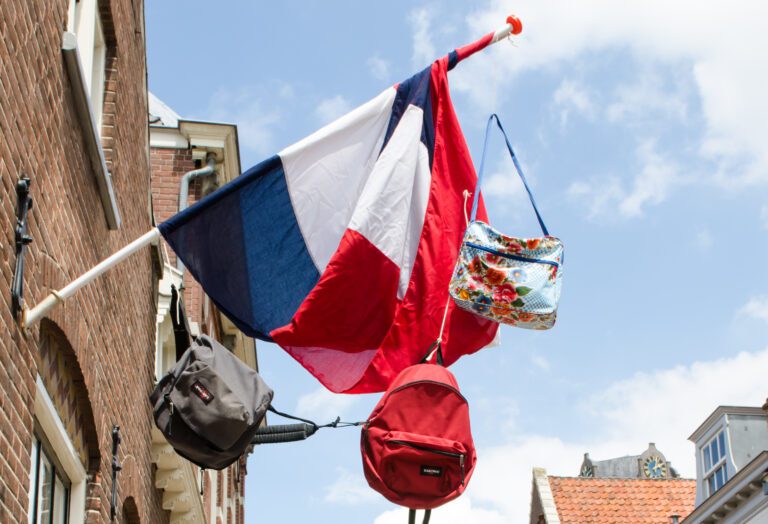 Here’s why you’ll see backpacks hanging on Dutch flagpoles from today