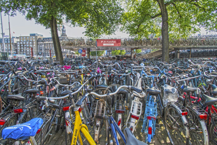 photo-of-alot-of-bikes-parked-together-on-a-bridge-in-Amsterdam