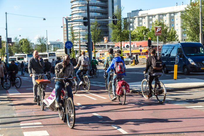 people-cycling-in-amsterdam-things-that-will-get-you-fined-in-the-netherlands