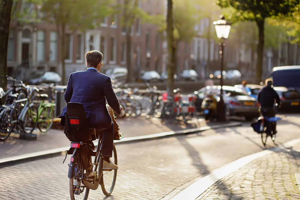 elegantly-dressed-man-on-his-way-to-work-in-amsterdam-government-encouragement-netherlands