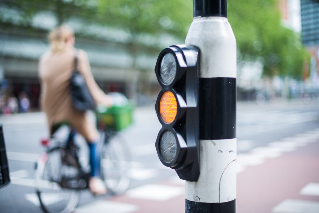 woman-on-bike-near-traffic-light-netherlands