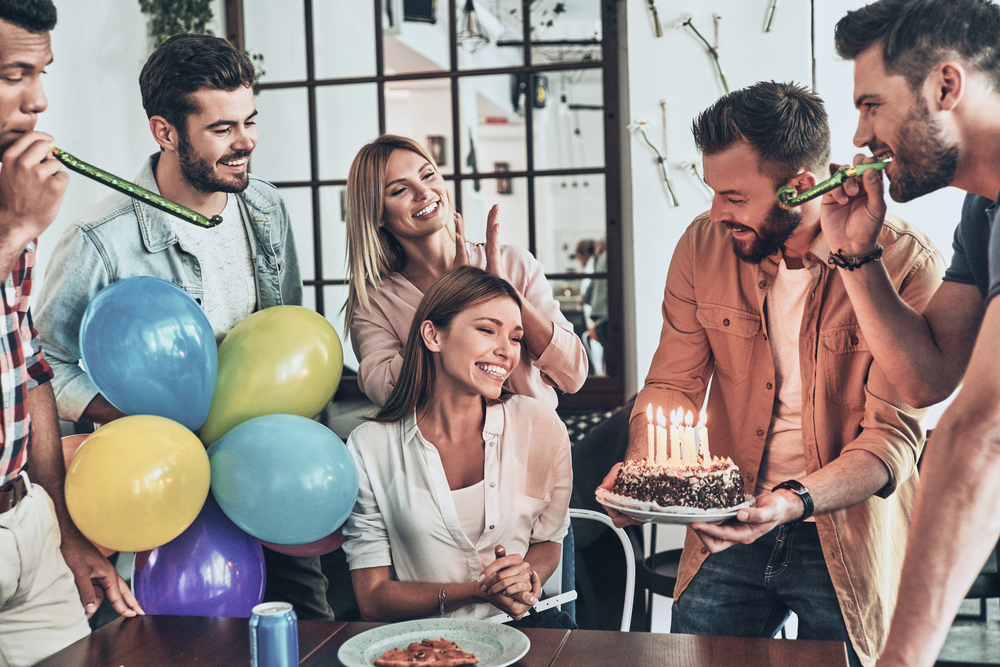 Dutch-people-gather-to-celebrate-their-friends-birthday-with-a-cake