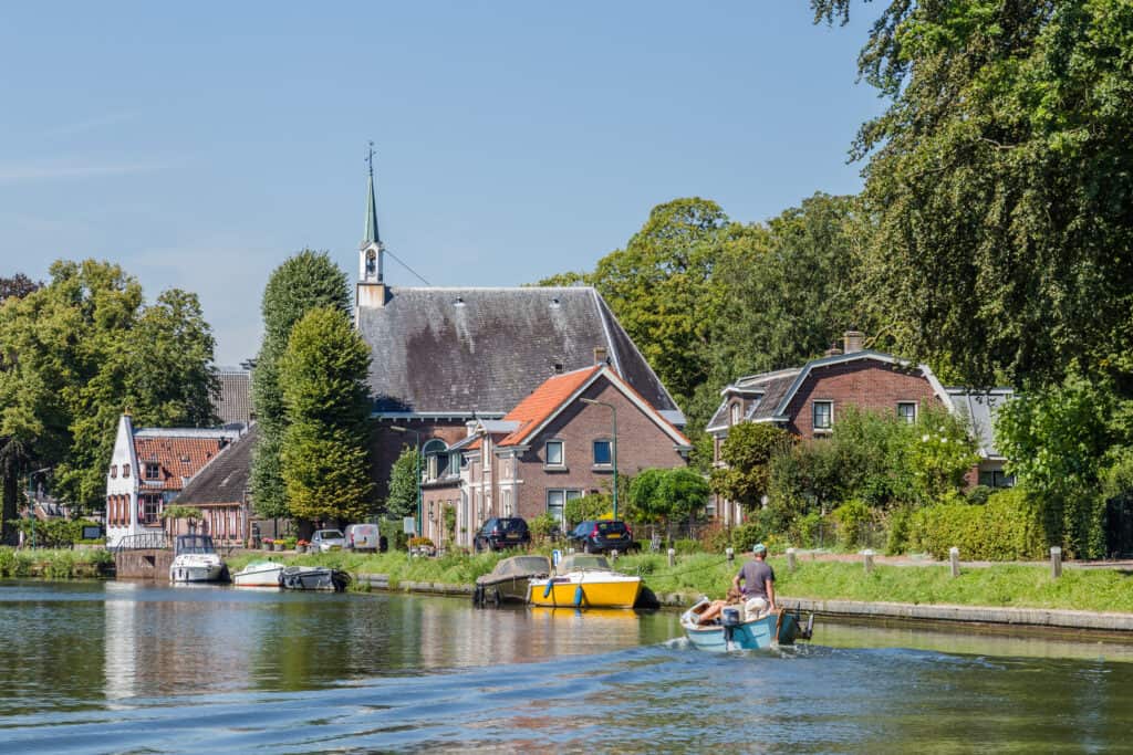 boat-on-the-river-vecht-in-utrecht-on-a-scenic-bike-path-in-the-netherlands