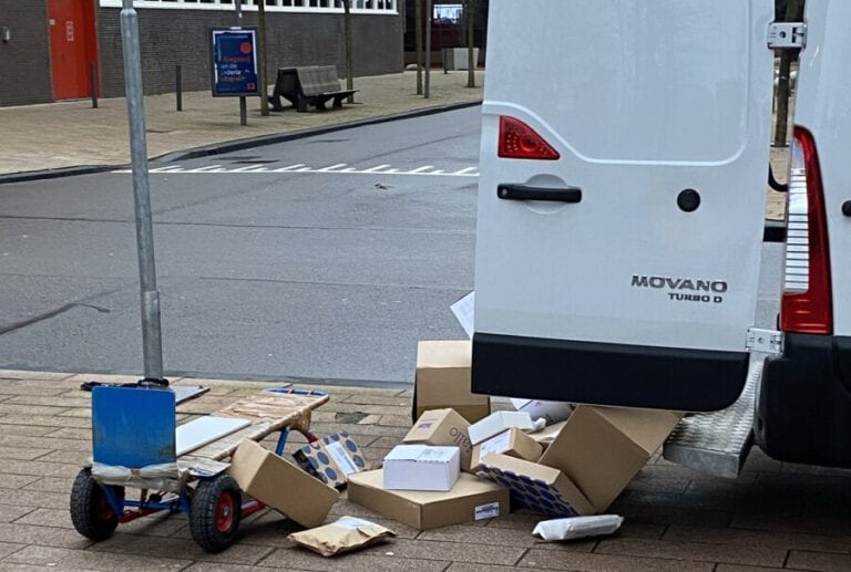 Onlookers shocked as PostNL delivery man throws parcels onto the street