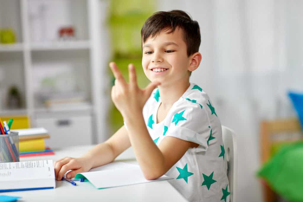 photo-of-boy-counting-with-his-hands-while-thinking-about-saving-money-in-the-netherlands