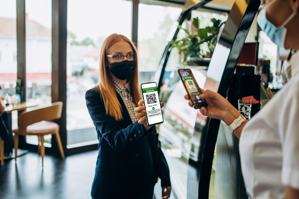 picture-of-a-woman-scanning-her-vaccination-QR-code