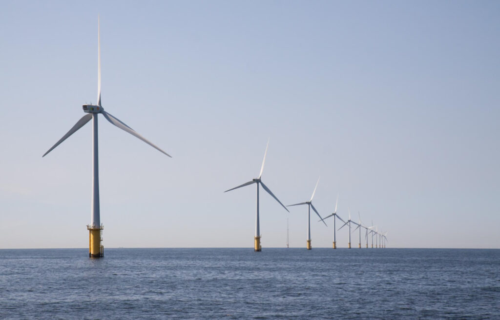 photo-of-windmills-on-sea-producing-green-energy-in-the-netherlands