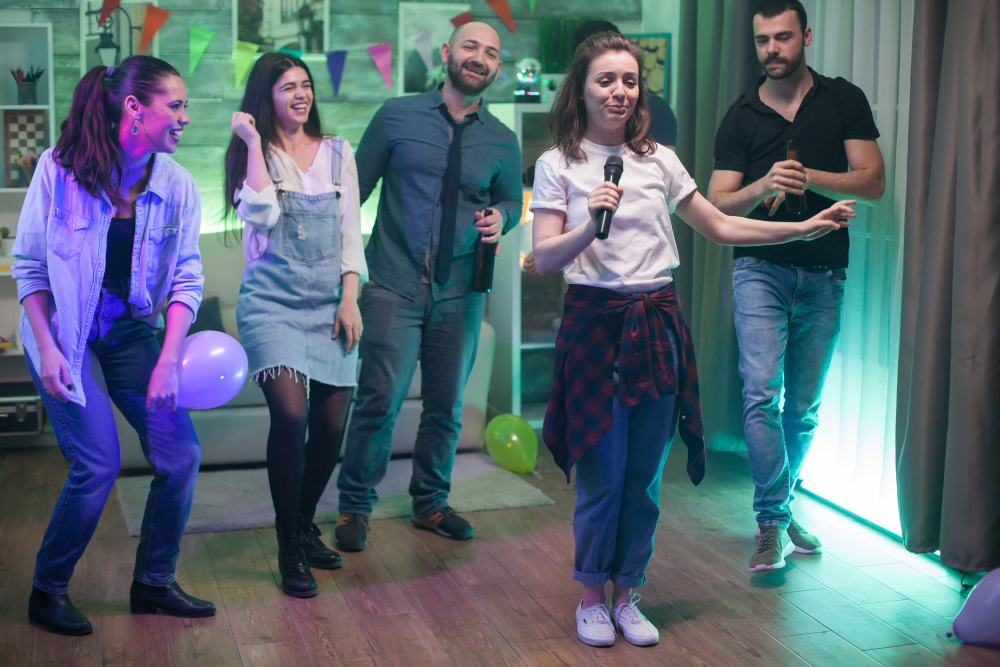 Photo-of-people-singing-karaoke-at-party-dressed-casually