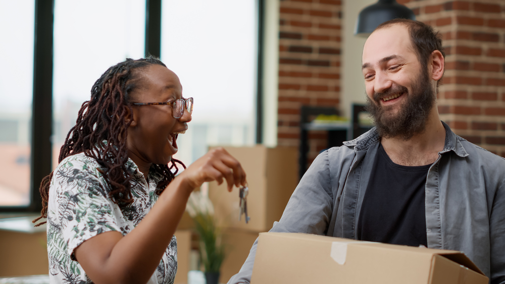 Photo-of-expat-couple-celebrating-buying-a-house-in-the-Netherlands