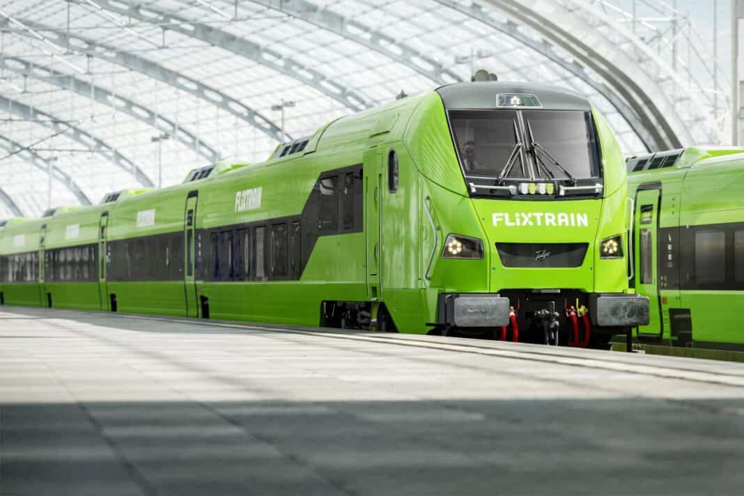 cheerful-lime-green-flixtrain-international-train-service-pulling-into-station-as-company-plans-expansion-to-the-netherlands