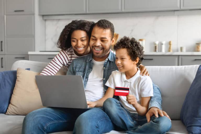 photo-of-cheerful-young-family-looking-at-computer-banking-together-with-ING-bank-in-the-Netherlands